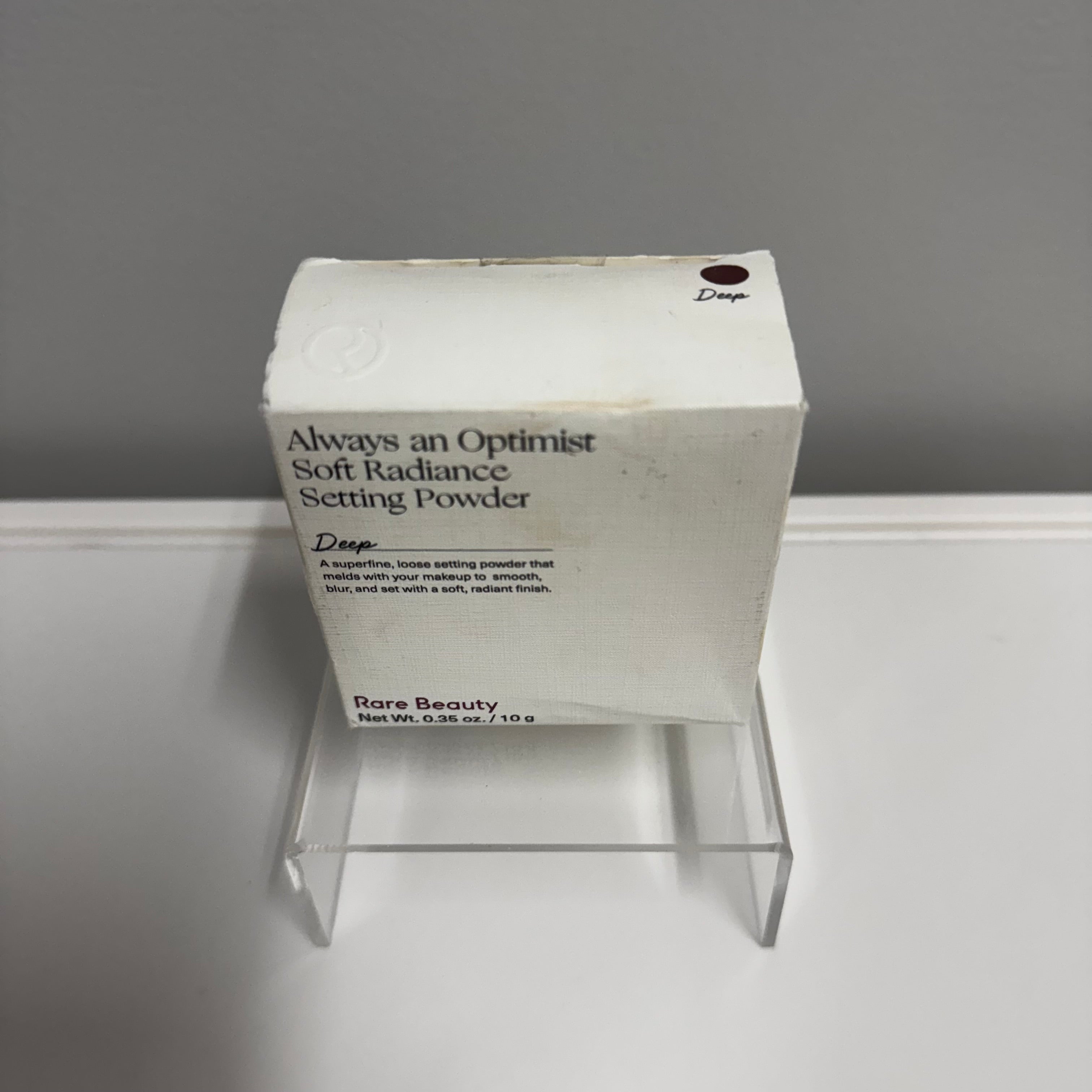 Rare Beauty Always an Optimist Soft Radiance Setting Powder in Deep (0.35 oz / 10 g).
